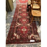 A PERSIAN TRIBAL RUNNER. 284 x 102cms TOGETHER WITH A PERSIAN HAMADAN RUG. 184 x 127cms (2)