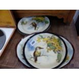 FOUR ROYAL DOULTON KOOKABURRA DECORATED PLATES AND BOWLS.