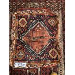 AN ANTIQUE HATCHLI BOKHARA RUG. 147 x 133cms TOGETHER WITH A ANTIQUE QASHGAI BAGFACE (2)