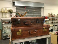 TWO VINTAGE LEATHER SUITCASES.