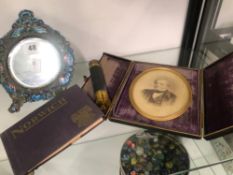 AN ANTIQUE ENAMELED DESK MIRROR, TOGETHER WITH A CASED PORTRAIT FRAME, A EXTENDING TELESCOPE AND