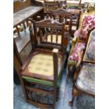 A SET OF FOUR LATE VICTORIAN DINING CHAIRS