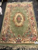 AN ORIENTAL RUG OF AUBUSSON DESIGN. 180 x 119cms