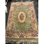 AN ORIENTAL RUG OF AUBUSSON DESIGN. 180 x 119cms