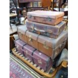 A QUANTITY OF VINTAGE CABIN TRUNKS AND SUITCASES