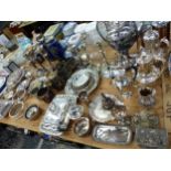 A LARGE COLLECTION OF SILVER PLATED WARES INC. VEGETABLE TUREENS, WINE COASTERS, CANDLESTICKS, TEA