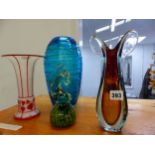 THREE ART GLASS VASES AND A PAPERWEIGHT.