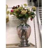 AN IRIDESCENT GLASS VASE OF FLOWERS