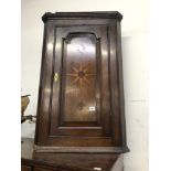 AN 18th CENTURY OAK CORNER CABINET