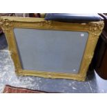 A LARGE ANTIQUE GILT FRAME