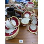 A VINTAGE TEASET AND A WOODEN MODEL BOAT