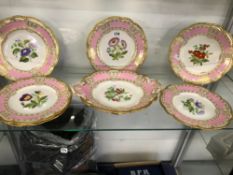 A 19th CENTURY PART DESSERT SERVICE WITH PINK RIMS ENCLOSING PAINTED FLOWER STEMS