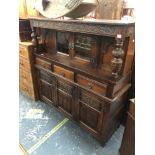 AN OLD CHARM OAK COURT CUPBOARD. H 137 W 138 D 46cms