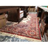 A MACHINE MADE CARPET OF PERSIAN DESIGN. 343 s 250cms