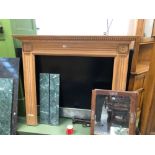 A VICTORIAN STYLE CARVED PINE FIRE SURROUND WITH ASSOCIATED BLACK SLATE HEARTH