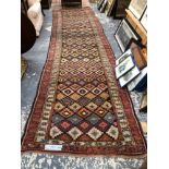 AN ANTIQUE PERSIAN TRIBAL RUNNER. 434 x 128cms