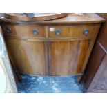 AN EDWARDIAN MAHOGANY BOW FRONT CABINET. H 94 W 92 D 49cms