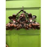 A VICTORIAN CARVED MAHOGANY FRUITING VINE ORNAMENT