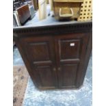 A GEORGIAN TWO DOOR CORNER CABINET. H 98 W 77 D 44cms