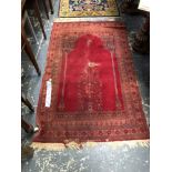 A MACHINE MADE RUG OF PERSIAN PRAYER DESIGN. 170 x 102cms