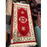 A GOOD QUALITY CHINESE RUG. 165 x 78cms