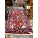 A PERSIAN HAMADAN RUG. 229 x 131cms