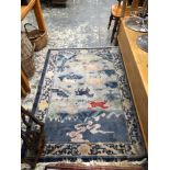 A CHINESE RUG OF ANIMAL DESIGN. 179 x 126cms