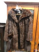 A VINTAGE FUR COAT BY SMITH AND SONS