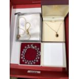 A 9ct GOLD AND GARNET PENDENT, A GIVENCHY PENDENT AND A VINTAGE DIAMANTE BRACELET.