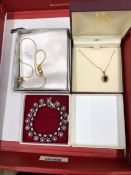 A 9ct GOLD AND GARNET PENDENT, A GIVENCHY PENDENT AND A VINTAGE DIAMANTE BRACELET.