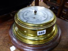 A BRASS CASED WALL BAROMETER