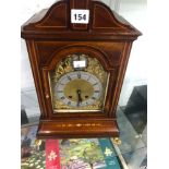 A LINE INLAID MAHOGANY CASED MANTLE CLOCK CHIMING ON TWO COILED RODS