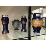 A PAIR OF DOULTON VASES MOUNTED WITH SILVER RIMS TOGETHER WITH A DOULTON AND SLATER VASE AND A JUG