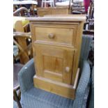 A SMALL PINE BEDSIDE CABINET. H 65 W 39 D 29cms