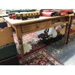 AN ANTIQUE SMALL PINE KITCHEN TABLE