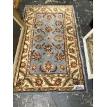 AN AFGHAN BOKHARA RUG. 220 x 130cms TOGETHER WITH A SMALL RUG OF PERSIAN DESIGN (2)