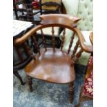 AN ANTIQUE CAPTAINS CHAIR