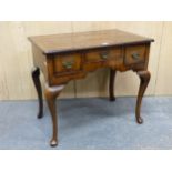 A GEORGIAN AND LATER CROSS BANDED AND FEATHER LINE INLAID WALNUT LOWBOY WITH THREE DRAWERS ABOVE THE