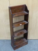 A LATE 19th C. MAHOGANY WATERFALL BOOKCASE, THE UPPERMOST OF THE FOUR SHELVES INSCRIBED HEUREUX CEUX