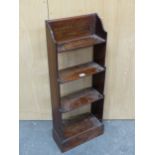 A LATE 19th C. MAHOGANY WATERFALL BOOKCASE, THE UPPERMOST OF THE FOUR SHELVES INSCRIBED HEUREUX CEUX