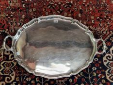 AN ELECTROPLATE TWO HANDLED OVAL TRAY. W 71cms.