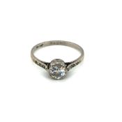 AN ANTIQUE PLATINUM AND OLD CUT DIAMOND SOLITAIRE RING. THE DIAMOND APPROX MEASUREMENTS 5.9 X 3.
