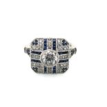 A HALLMARKED PLATINUM DIAMOND AND SAPPHIRE ART DECO STYLE RING. APPROX ESTIMATED DIAMOND WEIGHT 1.