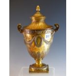 A SILVER GILT TWO HANDLED TROPHY CUP AND COVER BY CHARLES STUART HARRIS, LONDON 1912, THE SIDES WITH