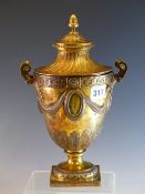 A SILVER GILT TWO HANDLED TROPHY CUP AND COVER BY CHARLES STUART HARRIS, LONDON 1912, THE SIDES WITH