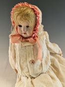 AN EICHORN AND SOHN BISQUE HEADED DOLL. H 42cms. TOGETHER WITH A SIMON AND HALBIG BISQUE HEADED