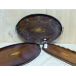 THREE MAHOGANY GALLERIED TWO HANDLED TRAYS, TWO INLAID WITH CENTRAL CONCH SHELLS AND THE THIRD