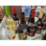 WINE AND LIQUEURS: TWO BOTTLES OF BAILEYS, ONE OF TIA MARIA, TWO WHITE WINES AND TWO RED