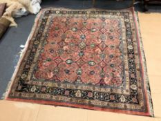 A PERSIAN RUG OF UNUSUAL SIZE AND DESIGN. 207 x 194cms
