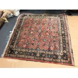 A PERSIAN RUG OF UNUSUAL SIZE AND DESIGN. 207 x 194cms